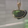 Dije en Oro de 14 quilates con moldavita faceteada