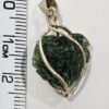26-78 (1) Dije en Oro de 14 quilates con moldavita natural